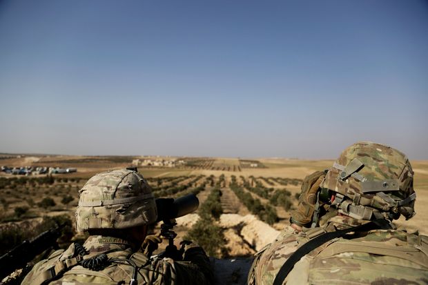 American troops looked out toward the border with Turkey from a small outpost near the town of Manbij, northern Syria, in February.