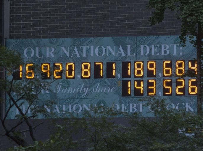 The national Debt Clock is seen in New York October 15, 2013. REUTERS/Andrew Kelly (UNITED STATES - Tags: ENVIRONMENT BUSINESS)