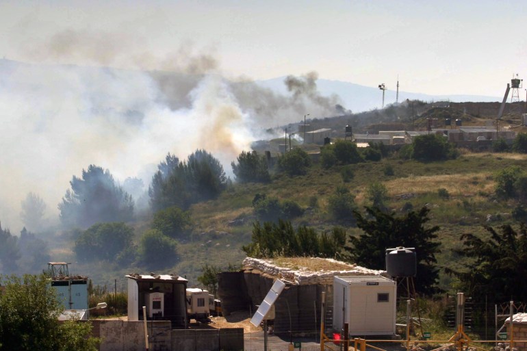Smoke rises from an Israeli military outpost following mortar and rocket attacks near Kibbutz Menara in northern Israel May 28, 2006. The Israeli army ordered residents living in northern areas to go to bomb shelters after a clash between Hizbollah and Israeli soldiers near Kibbutz Menara and mortar and rocket fire into northern Israel, Israeli security sources said. Israeli jets attacked Syrian-backed Palestinian and Lebanese guerrillas in Lebanon on Sunday, sparking gunbattles on the volatile border hours after rockets fired into northern Israel wounded an Israeli soldier. ISRAEL OUT REUTERS/Dror Artzi